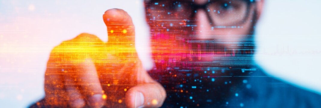 Close-up of a man's hand interacting with a digital interface, showcasing vibrant colors and data streams.