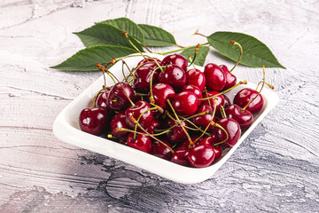 Red sweet cherry in the bowl