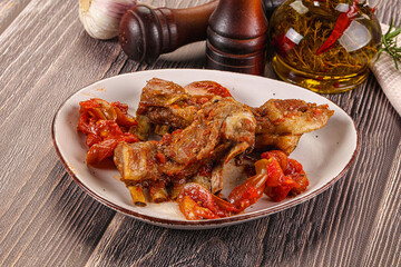 Baked lamb ribs with vegetables