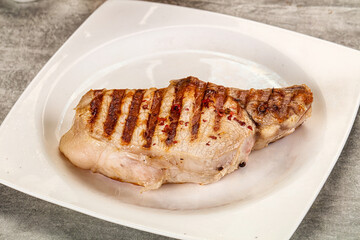 Grilled pork loin steak with bone