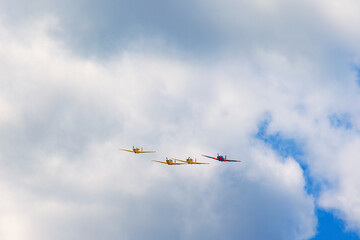 Formation flight with propeller plane among the clouds