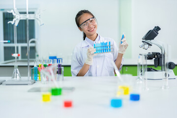 Fototapeta premium In a state-of-the-art research facility, the female scientist performed a complex experiment in the lab to ensure the medicine met the highest standards in the pharmaceutical industry.