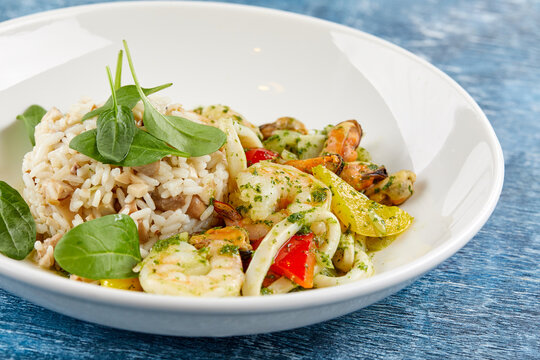 risotto with seafood on white plate