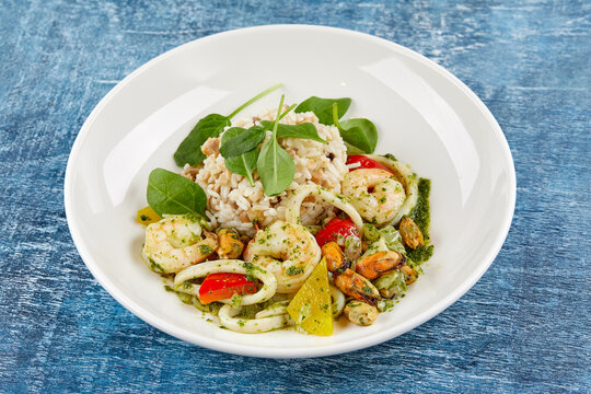 risotto with seafood on white plate
