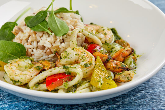 risotto with seafood on white plate