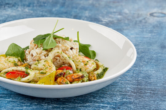 risotto with seafood on white plate