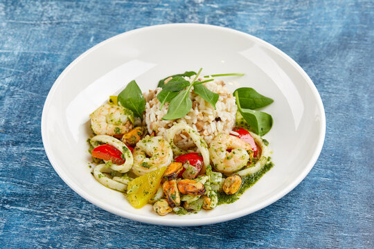 risotto with seafood on white plate