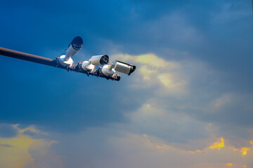 CCTV camera or surveillance operating on blue sky