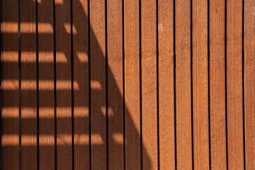 Wood plank wall background texture. Seamless pattern of modern wall panels with  light and shadow on vertical wooden slats for background