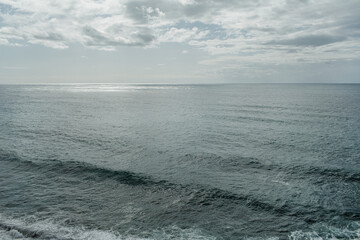 Serene Ocean View Under Cloudy Sky