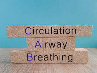 Concept words Circulation, Airway, Breathing on brick blocks. Beautiful blue background, wooden...