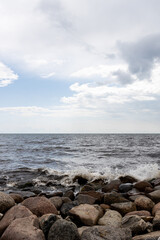 Waves splashing on stone shore.