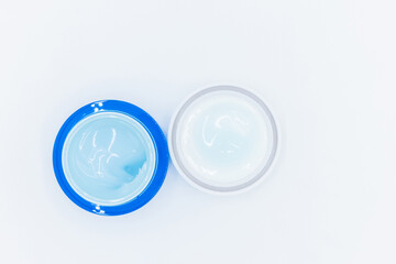 Top view blue water gel cosmetic serum in blue container, Liquid gel moisturizer, Blue gel serum texture make up and cosmetic texture background, skincare product and beauty cream..