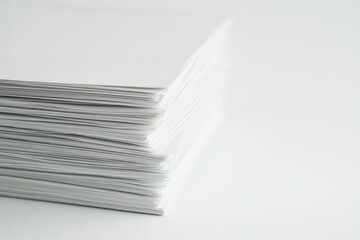 A close up view showing a large stack of white paper