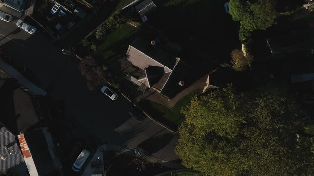 Clones Town, County Monaghan, Ireland, September 2022. Drone in Bird's Eye view pushes towards the Cassandra Hand Heritage Centre and ascends while orbiting clockwise above the building.
