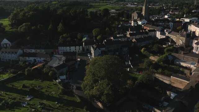 Clones Town, County Monaghan, Ireland, September 2022. Drone orbits clockwise while descending towards the Cassandra Hand Heritage Centre, showcasing its historic architecture and landscape.