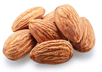 Pile of shelled almond nuts isolated on white background. File contains clipping path.