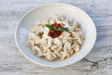 Mantı - Turkish ravioli pasta on wood concept	