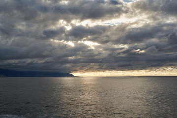 Storm clouds over the ocean at sunset........