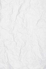 Crumpled paper texture provides a white abstract background