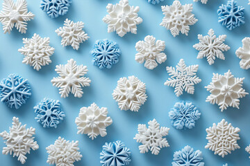 A serene white background adorned with delicate snowflakes, perfect for winter themes.