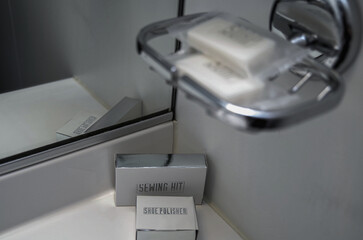 Classic interior design inside bathroom with hair dryer and hooks of cabin stateroom onboard luxury expedition cruiseship cruise ship liner with amenities	