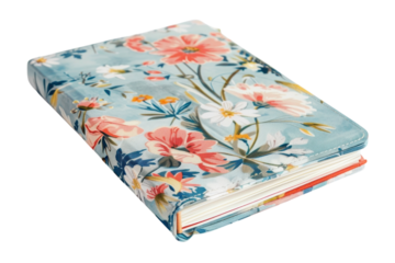 A beautifully designed floral journal resting on a soft surface, inviting creativity with its vibrant colors and intricate details