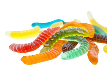 Naklejka premium Colorful gummy worms scattered across a white surface invite playful nostalgia and sweet indulgence during a sunny afternoon
