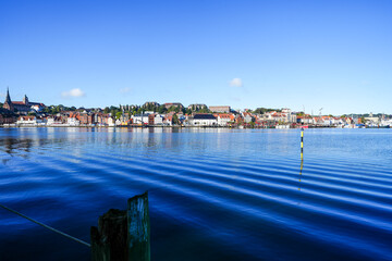 View of the historic harbor of the city of Flensburg and the surrounding landscape. Flensburg harbor on the fjord.
