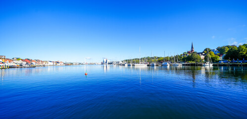 View of the historic harbor of the city of Flensburg and the surrounding landscape. Flensburg harbor on the fjord.
