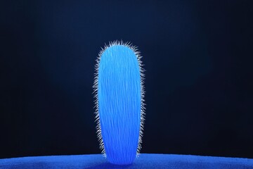 Vibrant blue cactus with striking spikes illuminates dark surroundings