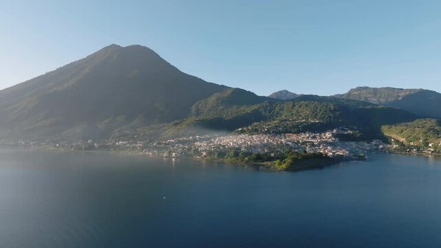 Beautiful landscape of San Pedro La Laguna village on Lake Atitlan at sunrise, Drone shot, Panoramic view