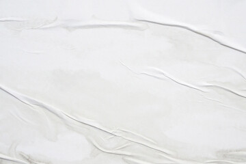 white crumpled and creased glued wrinkled paper poster texture background