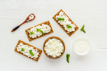 Healthy protein breakfast with crispy toasts and farm cottage cheese