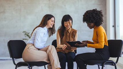 Diverse Group of Women Collaborating and Sharing Ideas in a Modern Office Setting