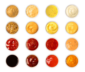 Set of various sauces in bowls, isolated on white background, top view