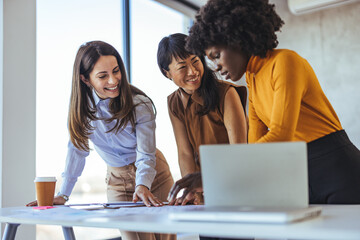 Diverse Team of Coworkers Collaborating at the Office on a Project