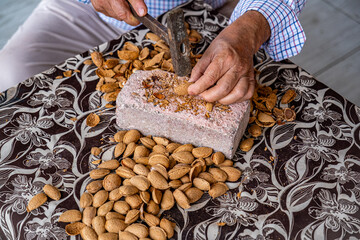Cracking Almond Shells with a Hammer