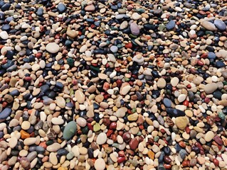 Wet colorful pebbles different shapes and colors natural background stones beach rocks close up natural pebbles texture amazing wallpaper
