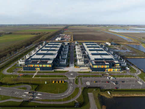 Aerial drone views of a supercomputer data center, artificial intelligence, and internet infrastructure in the Netherlands. Big data, quantum computing, supercomputer.
