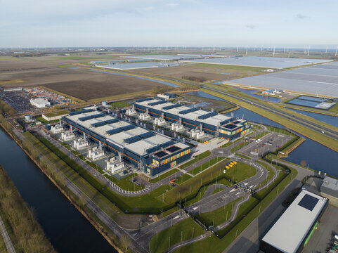 Aerial drone views of a supercomputer data center, artificial intelligence, and internet infrastructure in the Netherlands. Big data, quantum computing, supercomputer.