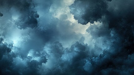 Obraz premium Heavy storm clouds gather above, casting a menacing atmosphere over the landscape with shades of gray, blue, and black indicating impending turmoil