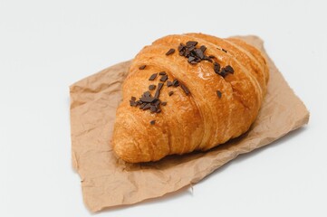 fresh baked croissant isolated on white background