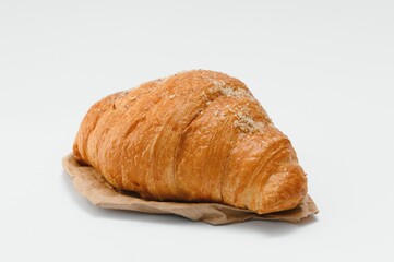 fresh baked croissant isolated on white background