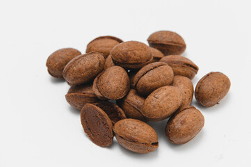 Delicious nut shaped cookies with boiled condensed milk on white background