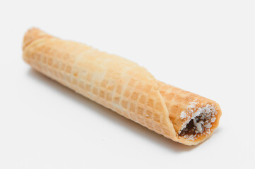 Delicious wafer rolls with boiled condensed milk isolated on white background