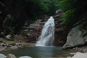 Fototapeta premium Majestic Waterfall in Lush Green Forest