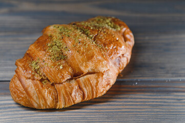 fresh croissant on a wooden background