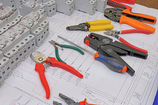 Wiring tools from Knipex, Weidm&uuml;ller on an electronic digram during the assembly of an electrical panel. 