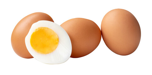 Front view or top view of raw brown chicken eggs and cooked or boiled chicken egg with egg yolk in half in pile or stack isolated with clipping path in png file format